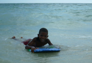 A local boy having a play with our body board